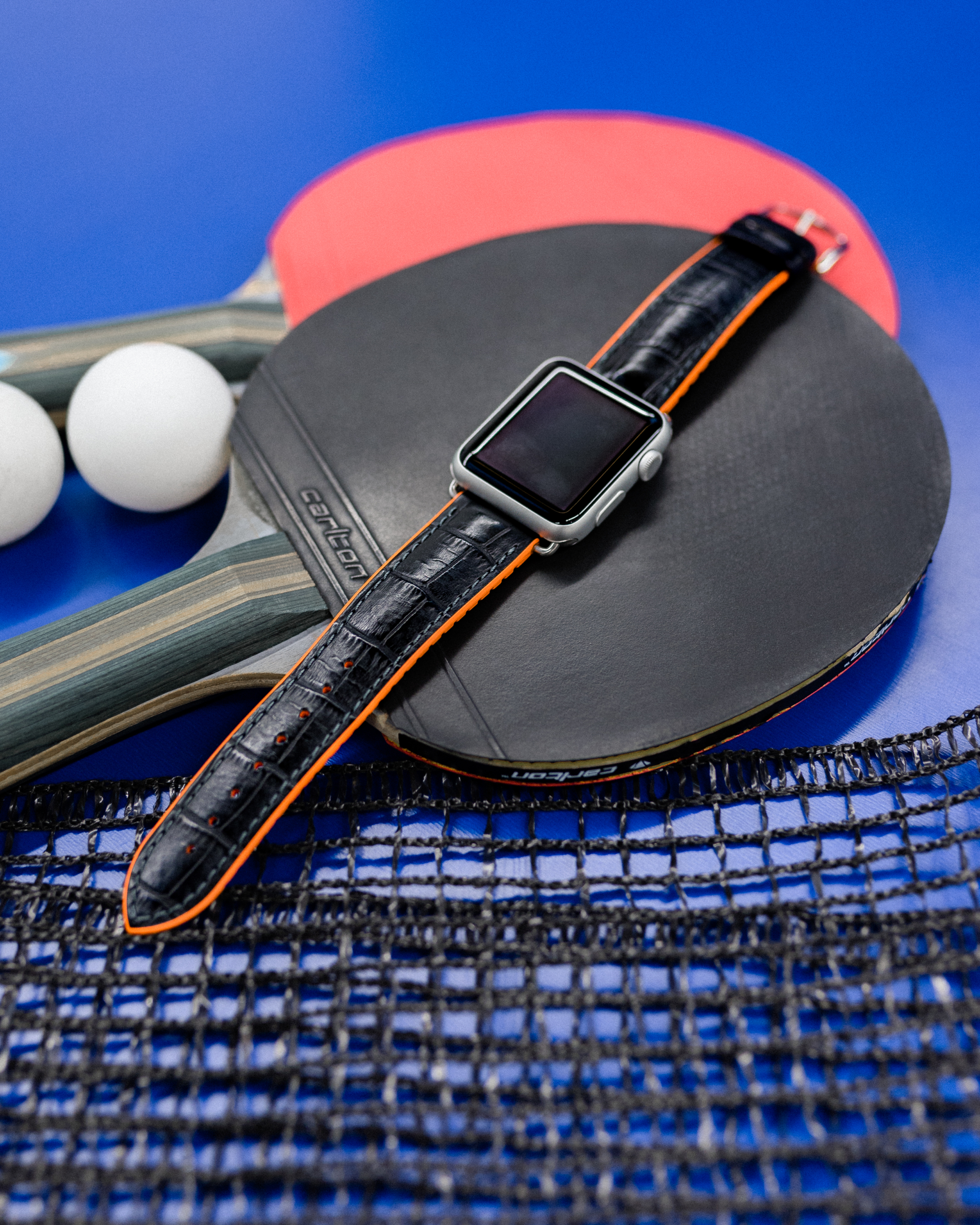 hirsch-flatlay-andy-orange-pinpong-applewatch